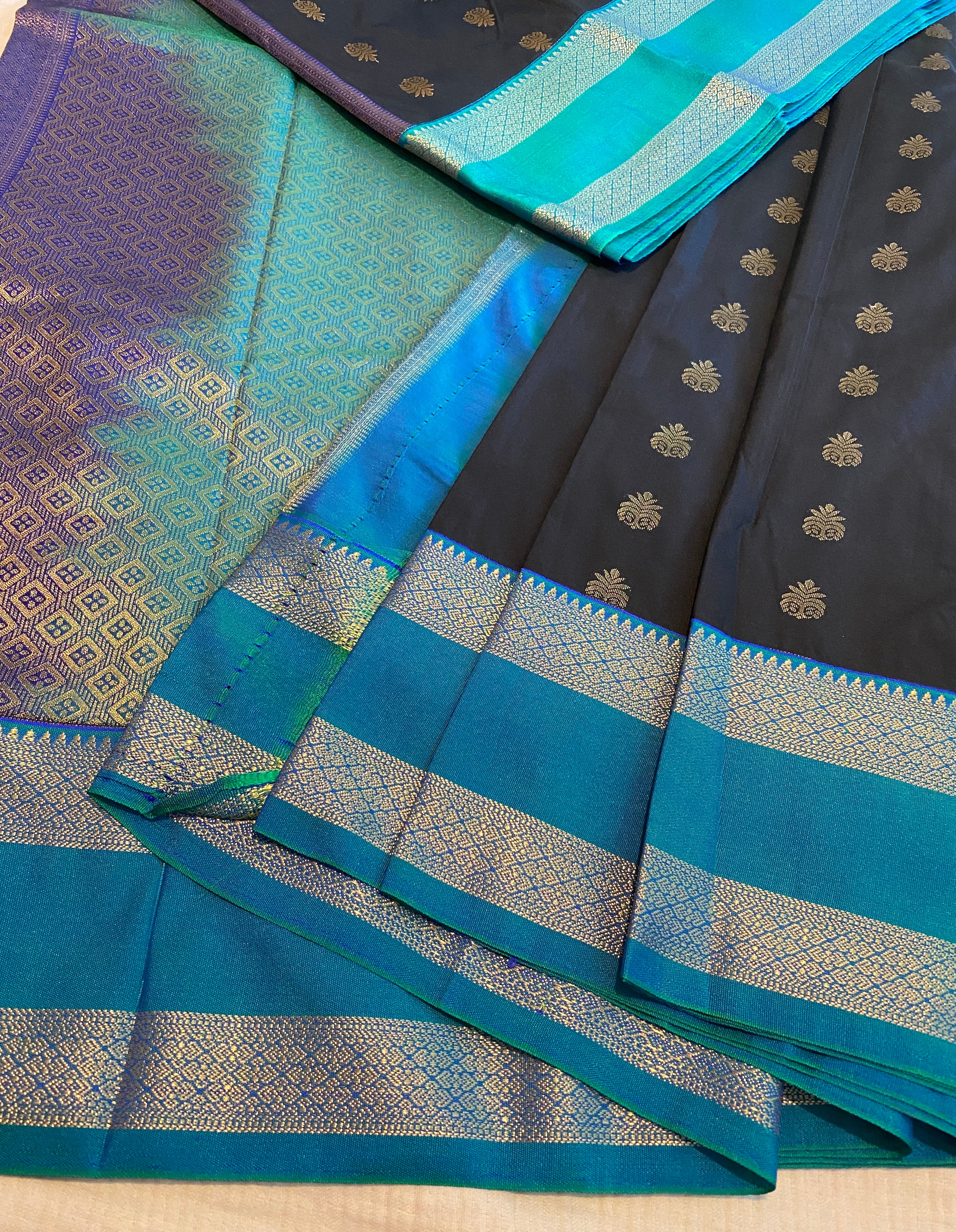 Black Premium Semi-Kanchipuram Silk Saree with Peacock Blue Zari Border & Gold Zari Motifs