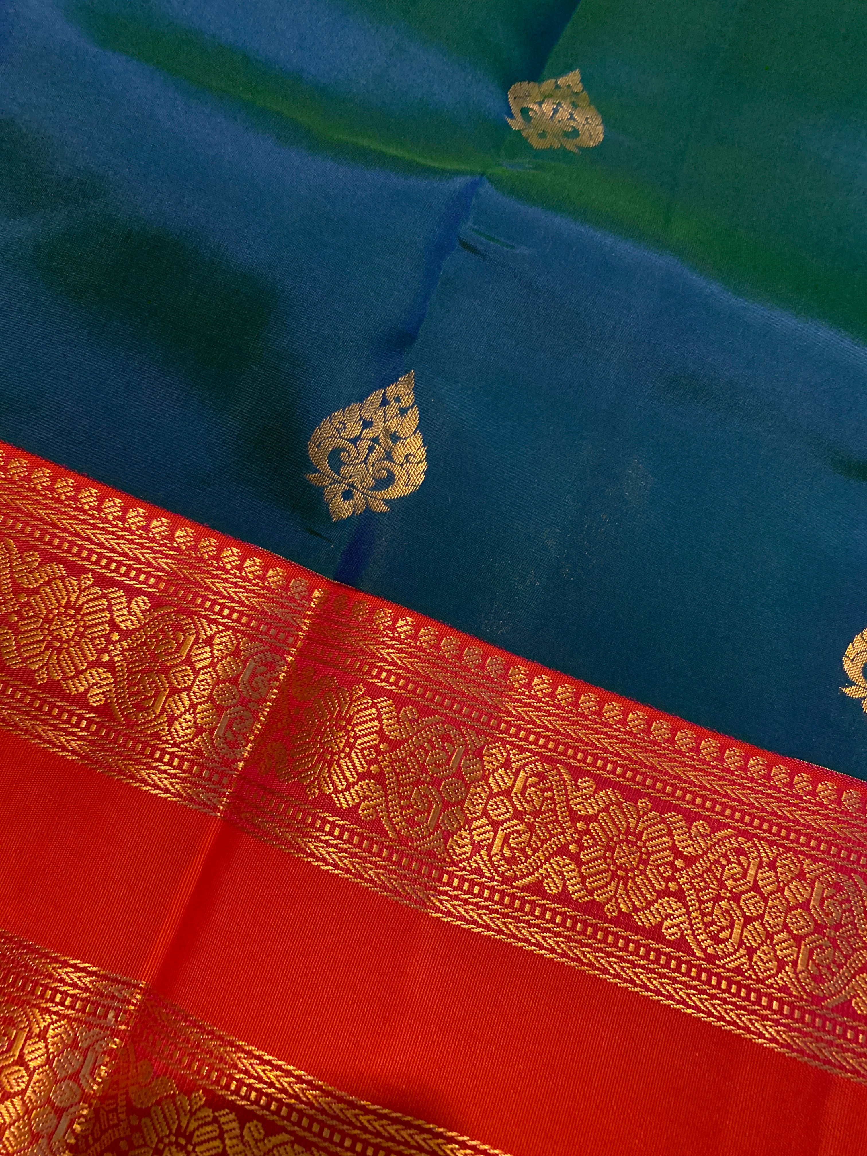 Pure Kanchipuram Silk Saree | Peacock Blue with Vibrant Reddish-Orange Zari Border