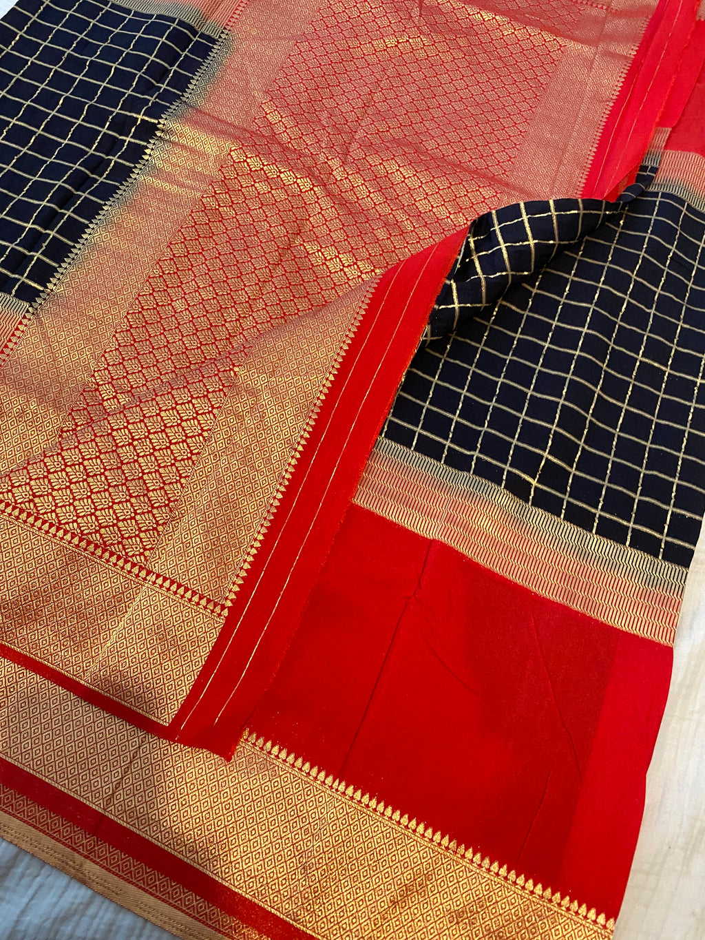 Georgette Saree in Black & Red with Gold Zari Checks