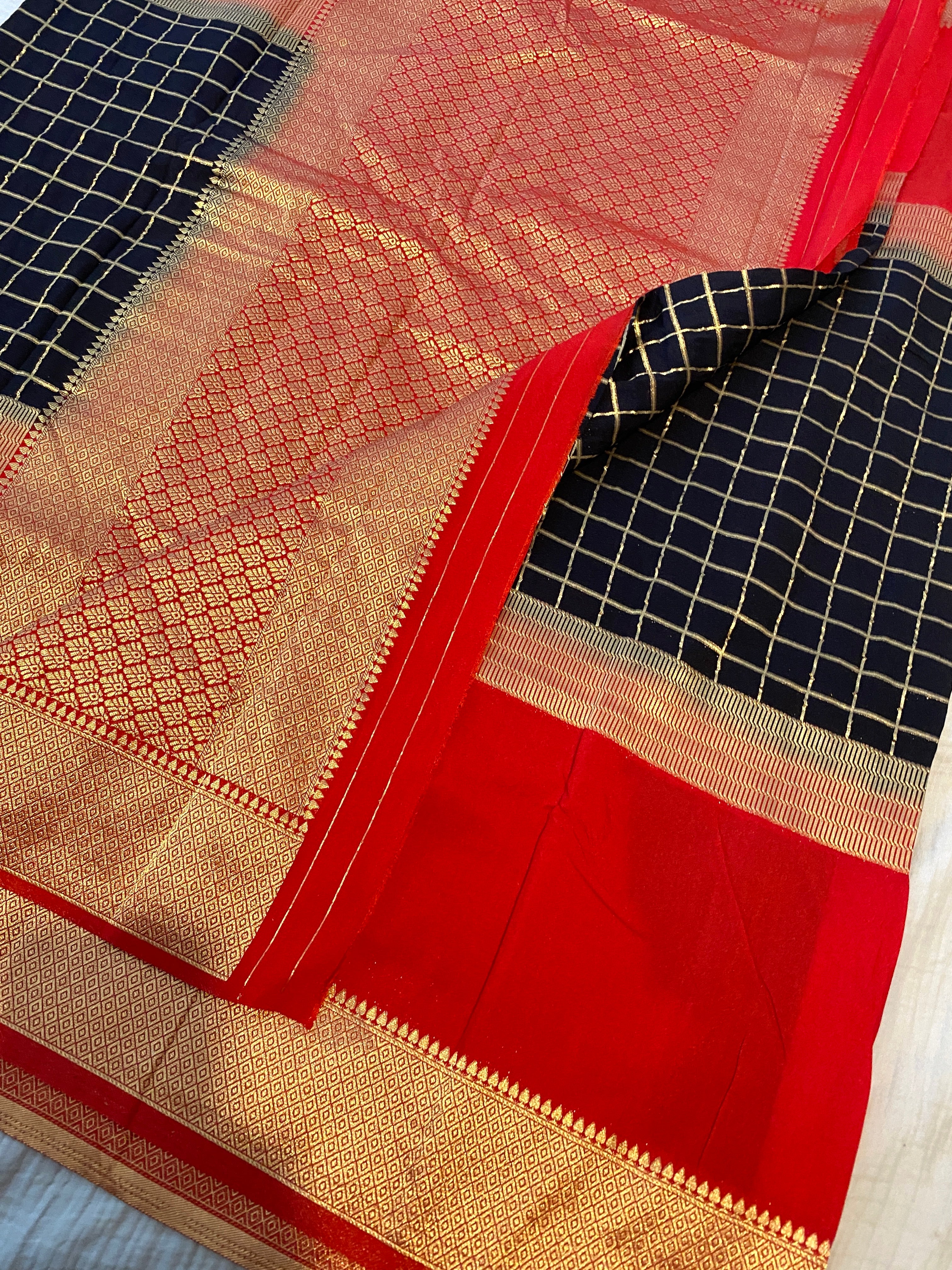 Georgette Saree in Black & Red with Gold Zari Checks