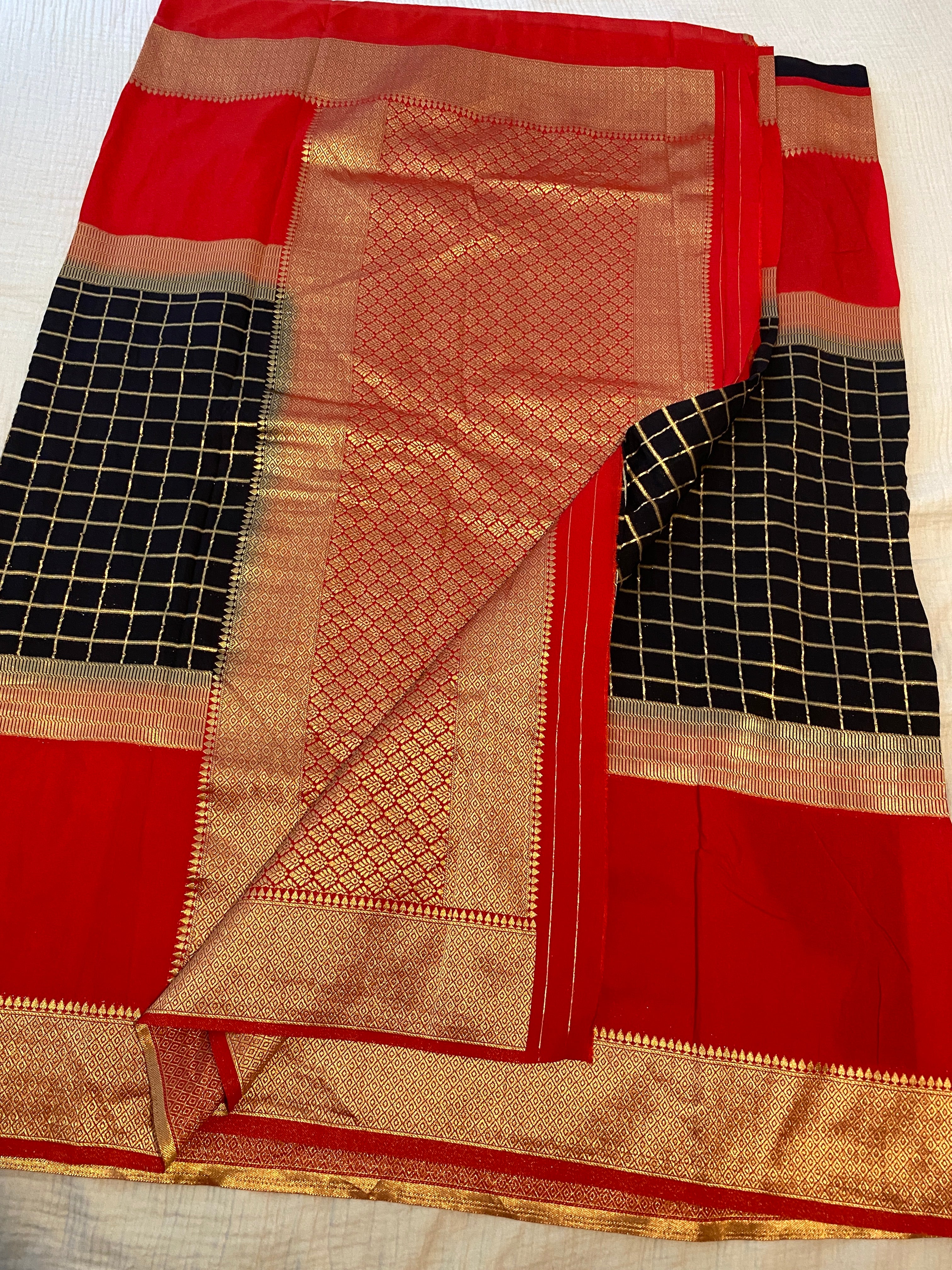 Georgette Saree in Black & Red with Gold Zari Checks