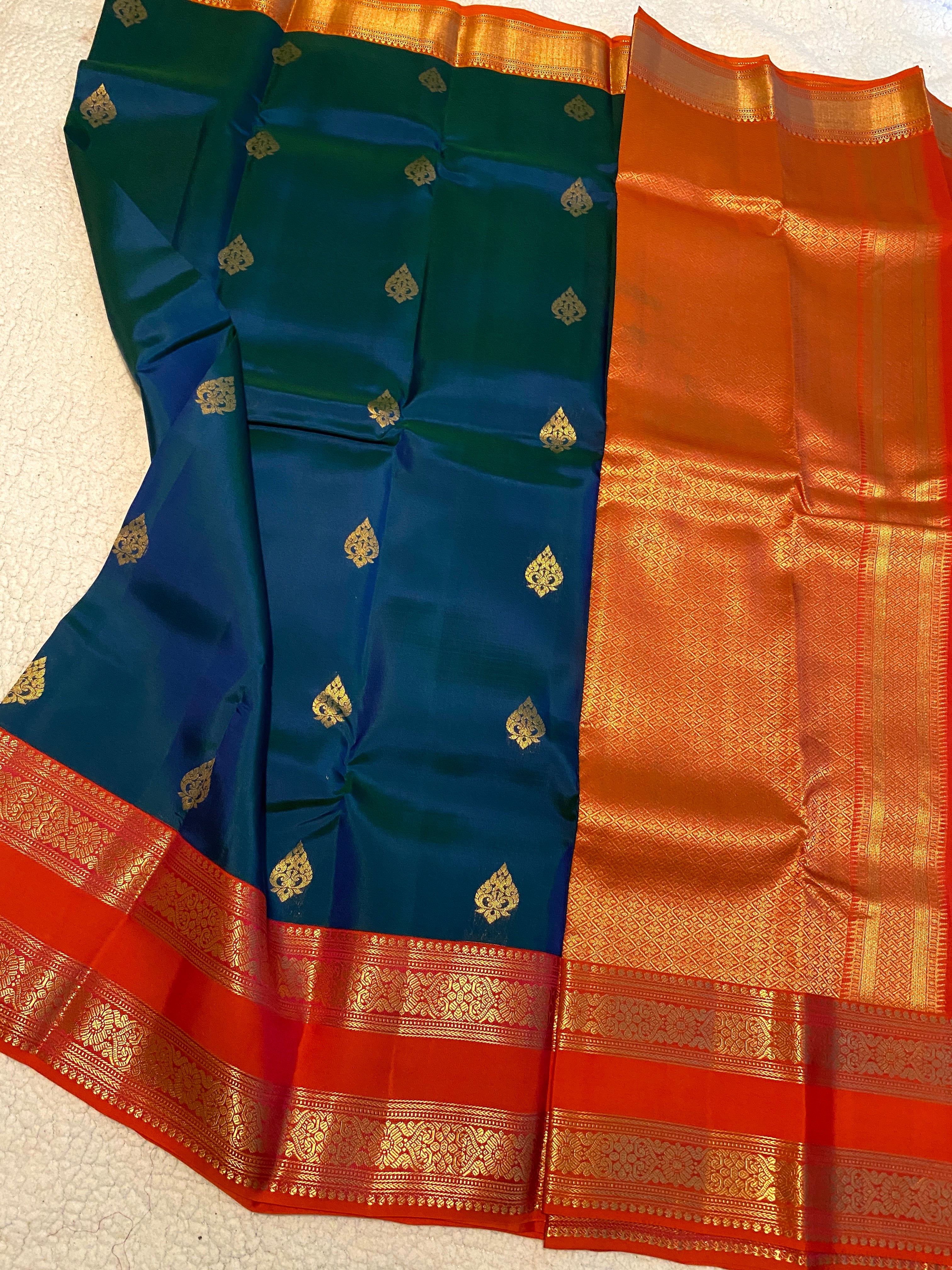 Pure Kanchipuram Silk Saree | Peacock Blue with Vibrant Reddish-Orange Zari Border