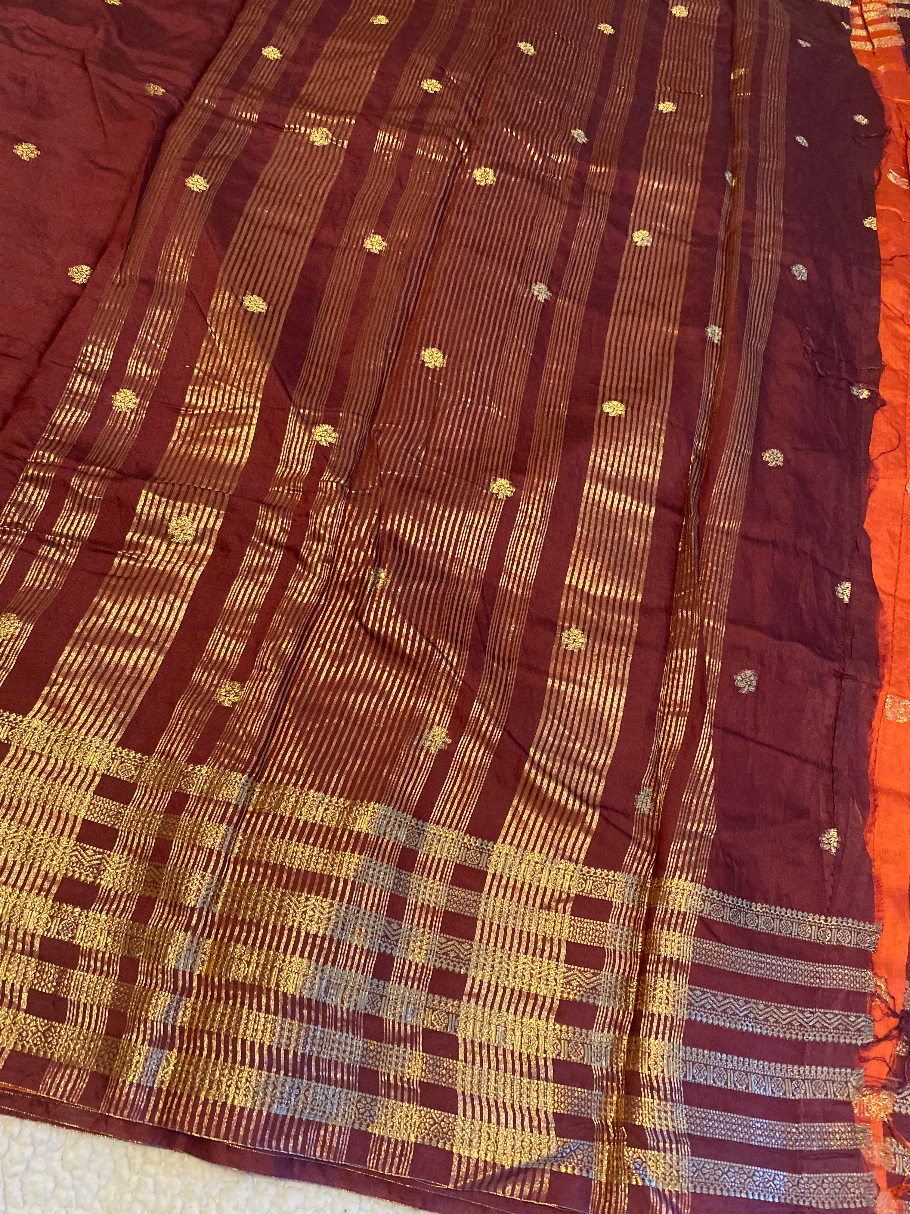 Rusty Maroon Assam Silk Saree with Gold Zari Border & Orange Blouse