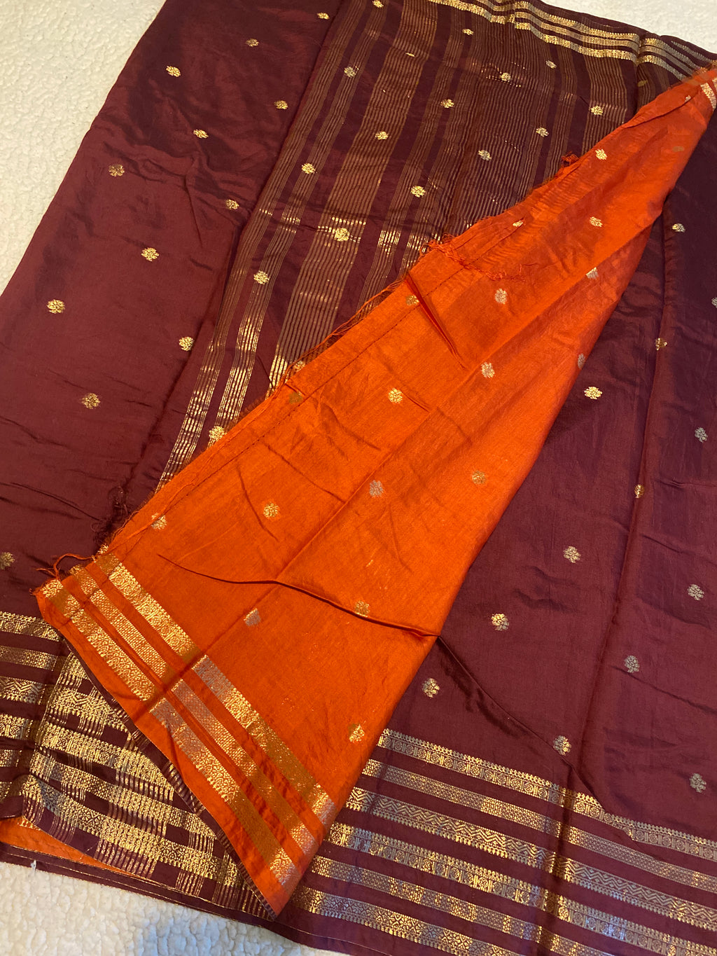Rusty Maroon Assam Silk Saree with Gold Zari Border & Orange Blouse